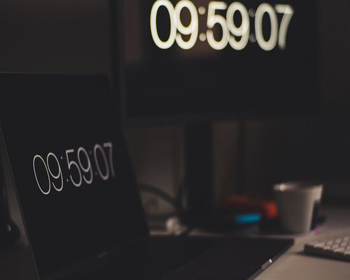Details of a computer setup with natural light indicating a break time