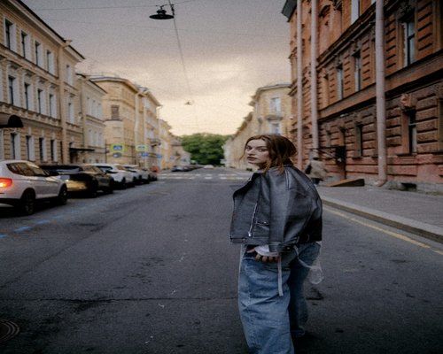 Person walking comfortably on a wide city sidewalk