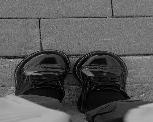 Detail of comfortable shoes walking on urban pavement